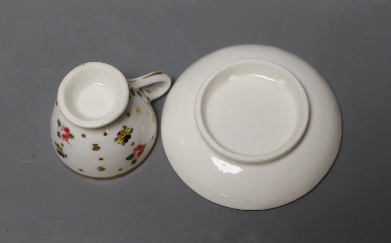 Chamberlain's miniature cup and saucer painted with flowers c.1820 - 4cm high